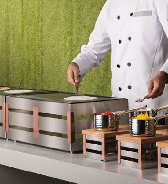 Chef at a live cooking station