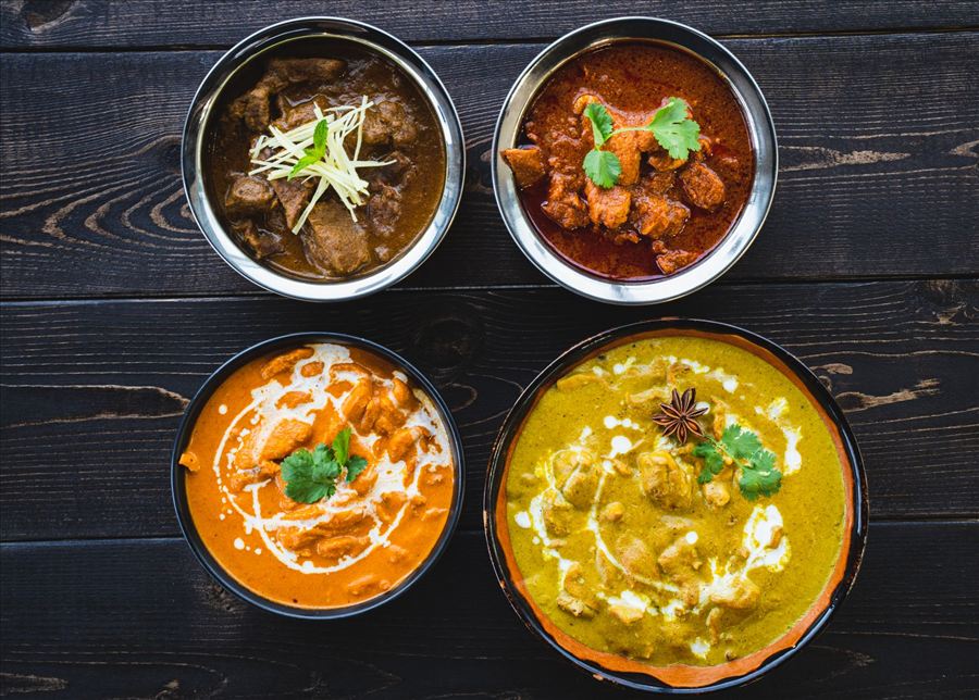 Bowls of tikka masala and curries
